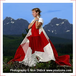 Dana Asher stands with the Canadian flag